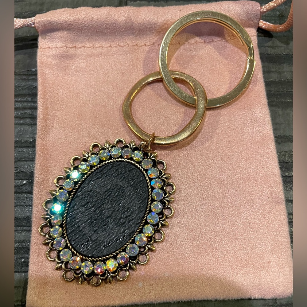 Antique gold LV rhinestone keychain. Can be made into a necklace.